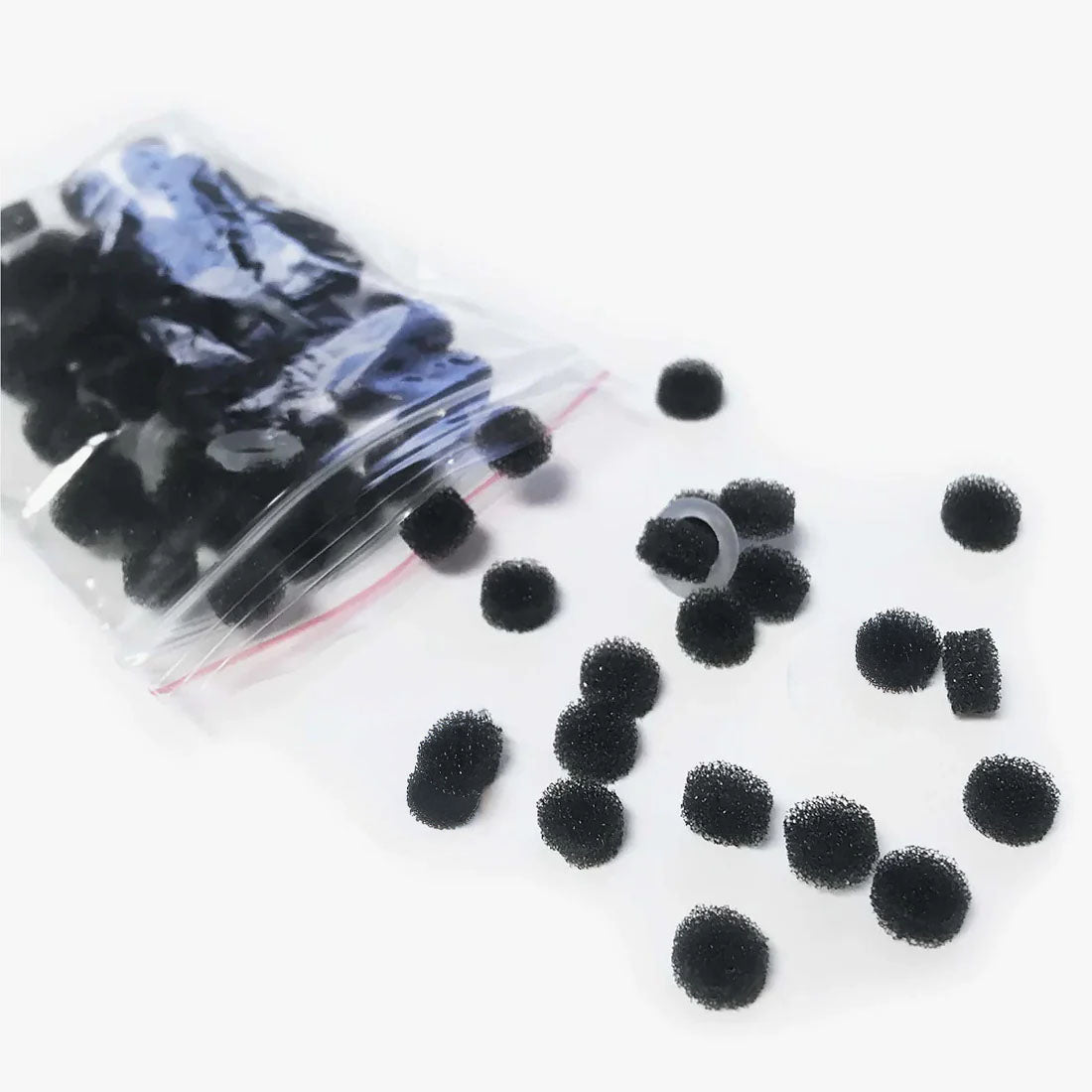 A clear plastic bag labeled Spa Sciences BELLA Complete Set contains replacement filters and O-rings, with several filters and O-rings scattered on a white surface.