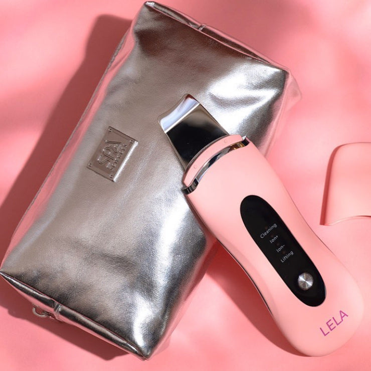 A Spa Sciences 'Perfect Pores' Set is sitting on top of a pink bag.