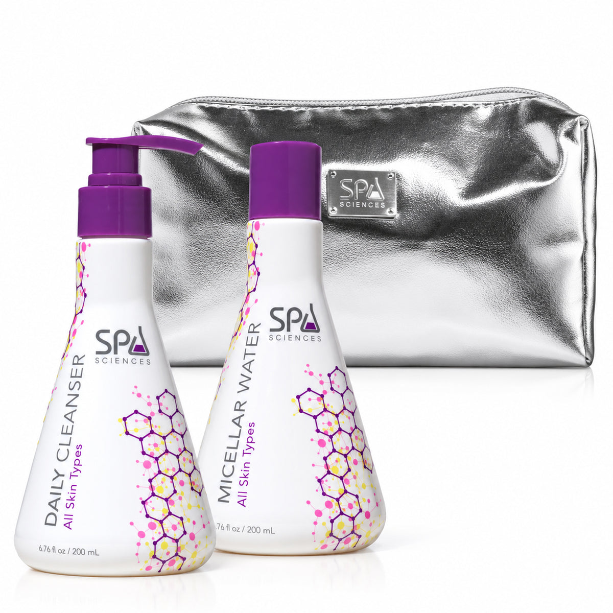 Spa Sciences Double Cleanse Duo, consisting of two bottles of facial cleanser and micellar water with purple pumps, alongside a silver cosmetic bag.