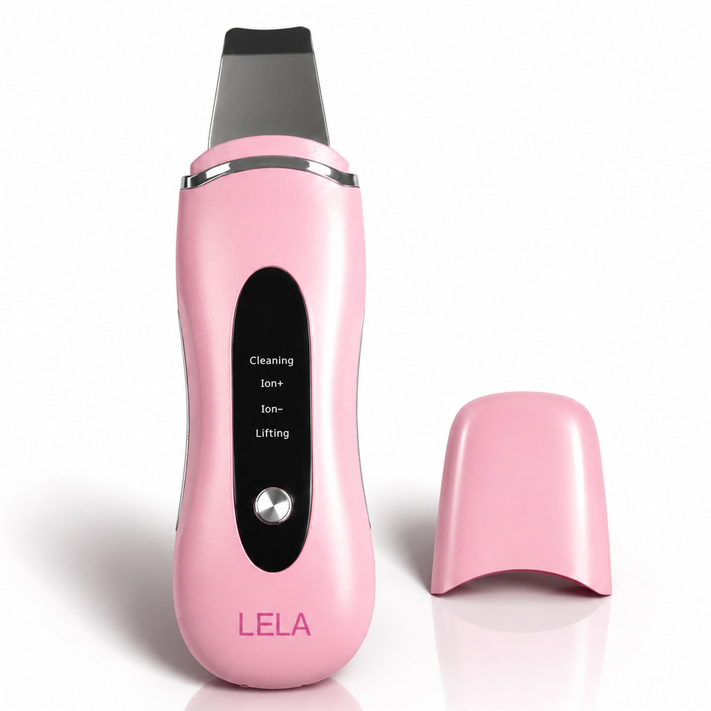 A pink Spa Sciences LELA handheld ultrasonic skin spatula device, featuring a black control panel with deep cleaning modes, rests beside its matching pink cap.