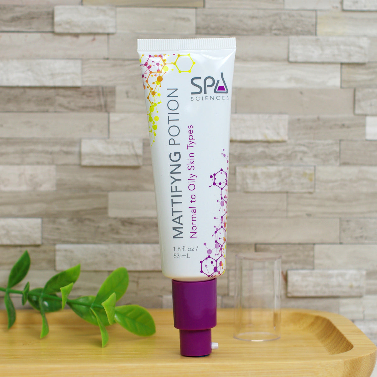 A tube of Shine Control System mattifying potion for oily skin with a purple pump dispenser and a clear cap.