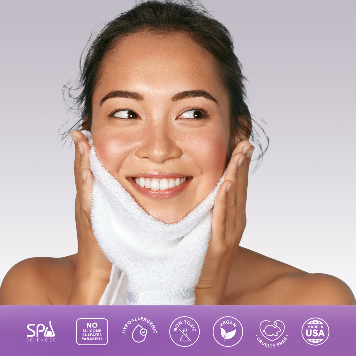 A person smiling while gently pressing a white towel to their face above a purple Ultimate Self-Care Set banner featuring vegan, cruelty-free, and non-toxic icons.