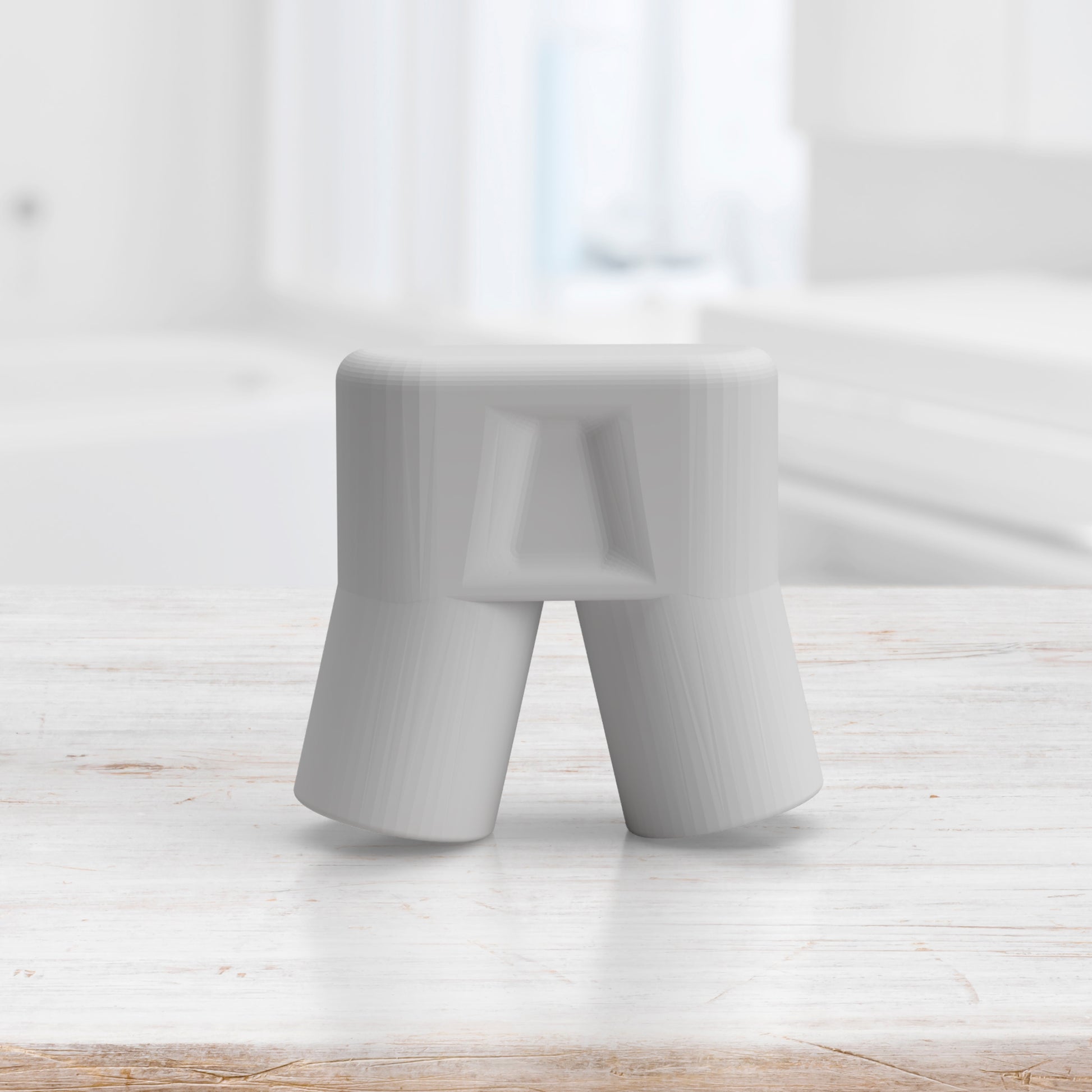 The Auto Clean Tube by Spa Sciences, a white plastic object that resembles upside-down shorts, is elegantly placed on a light wooden surface. Its sleek design is complemented by a proprietary accessory, with the blurred backdrop of a kitchen adding to its allure.