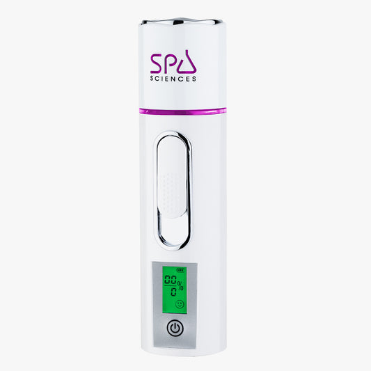 The NANO MISTER by Spa Sciences is a white handheld electronic device featuring an LCD screen, an on/off button, and the text "Spa Sciences" printed at the top.