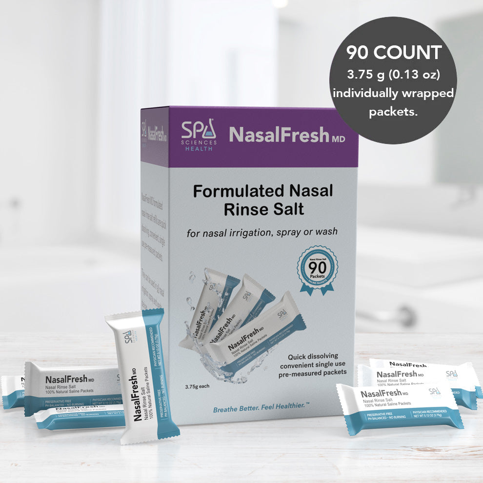 A box of Spa Sciences NasalFresh MD Formulated Nasal Rinse Salt - 90 Count Refill Packets for effective nasal irrigation with individual packets, each weighing 3.75 grams (0.13 ounces). Several packets are scattered in the foreground.