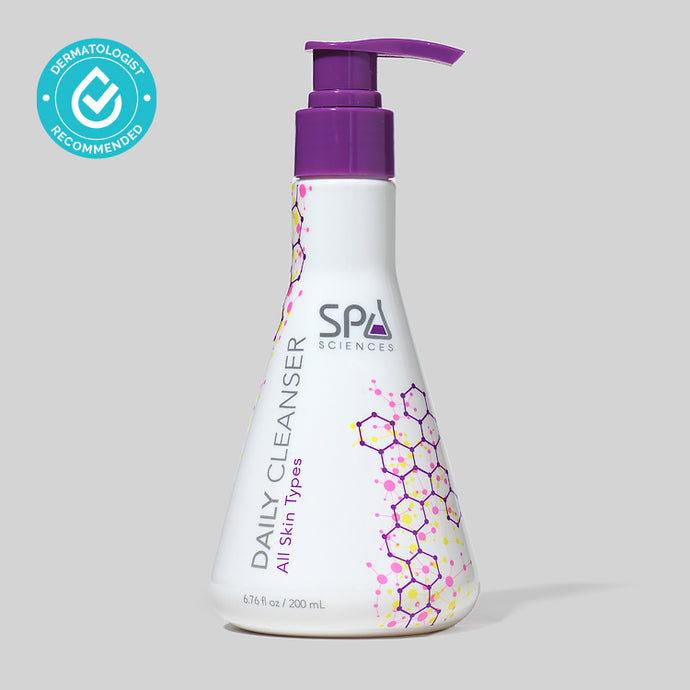 A bottle of Spa Sciences Daily Cleanser to hydrate on a light grey background.