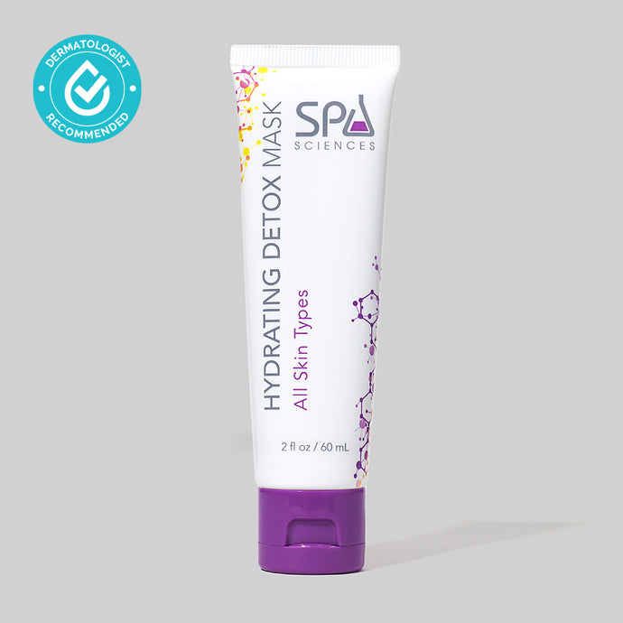 A tube of Spa Sciences Hydrating Detox Mask, designed to reduce pore size and promote healthy glow, rests on a grey background.