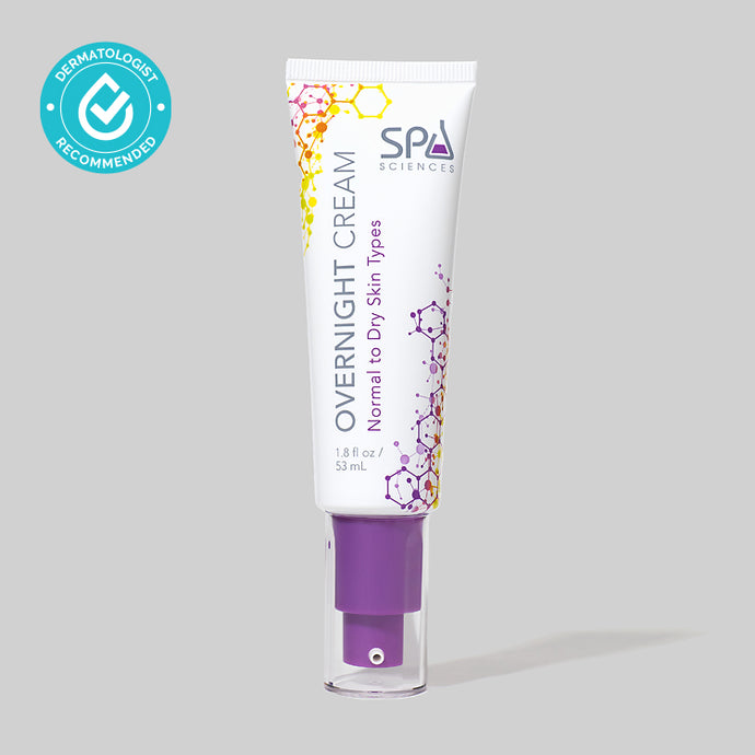 A tube of Spa Sciences' Overnight Cream Dry Skin, containing Hyaluronic Acid and aimed at reducing signs of aging and increasing moisture level, is displayed on a grey background.