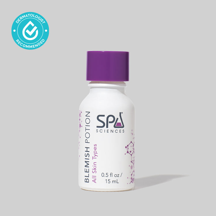 A bottle of Spa Sciences' Blemish Potion with niacinamide on a gray background.