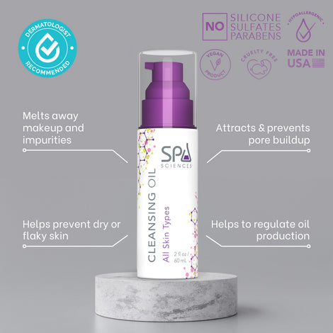 Spa Sciences' cleansing oil for makeup removal on a marble base.