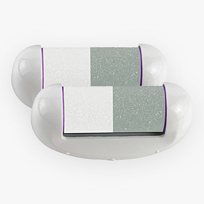 A pair of white and purple Spa Sciences Nail Polisher Heads with a purple stripe.